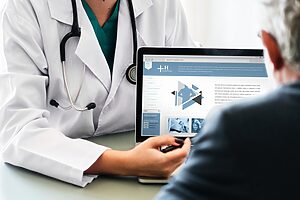 Nurse showing website to patient