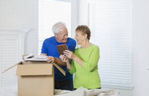 A senior coupling packing a box