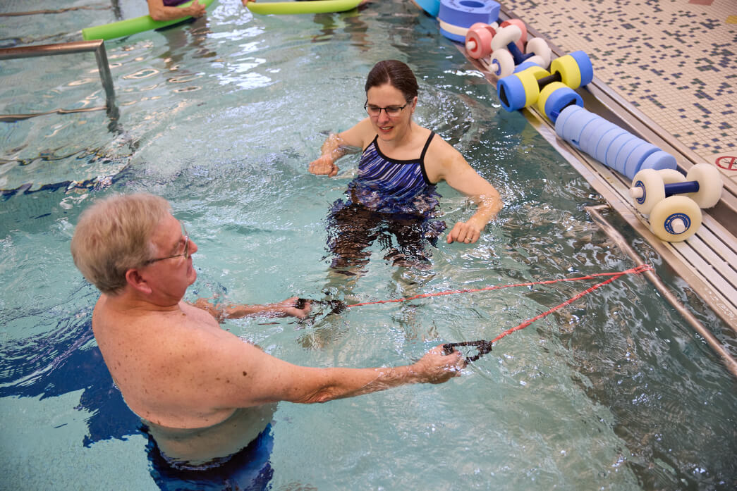 senior man exercising in the pool