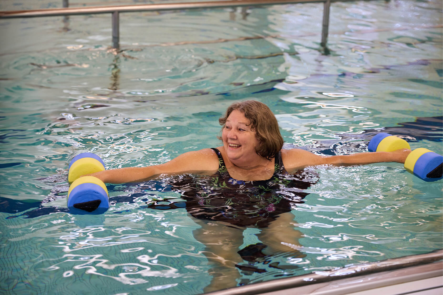 Senior woman exercising in the pool