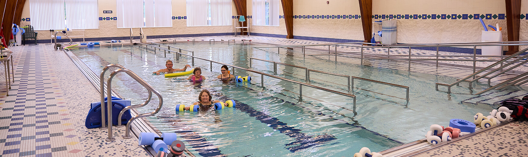 Seniors doing aerobics in the pool