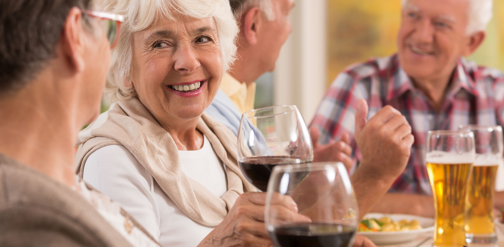 Seniors enjoying beverages at a table