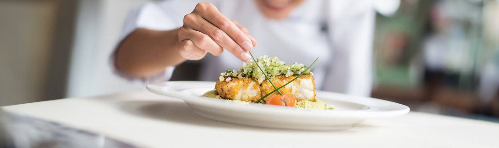 Chef garnishing a dish