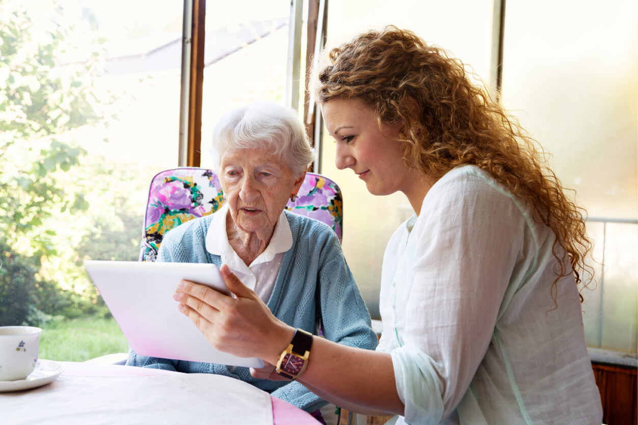 iStock-452746925 (1) Senior woman being shown a tablet by employee