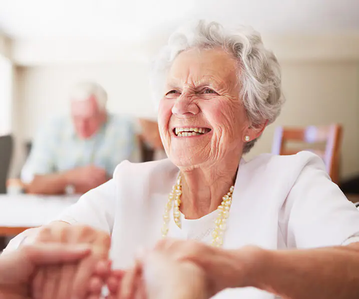 Senior woman holding hands