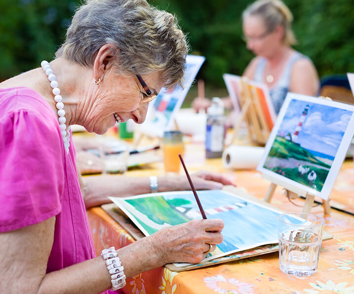 Senior woman at a painting class