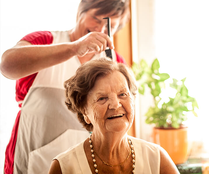 Senior woman getting her hair styled