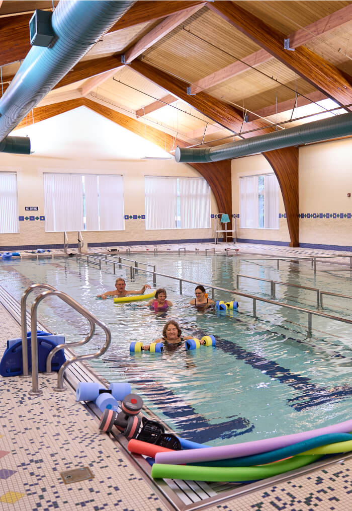 Seniors swimming in the pool together