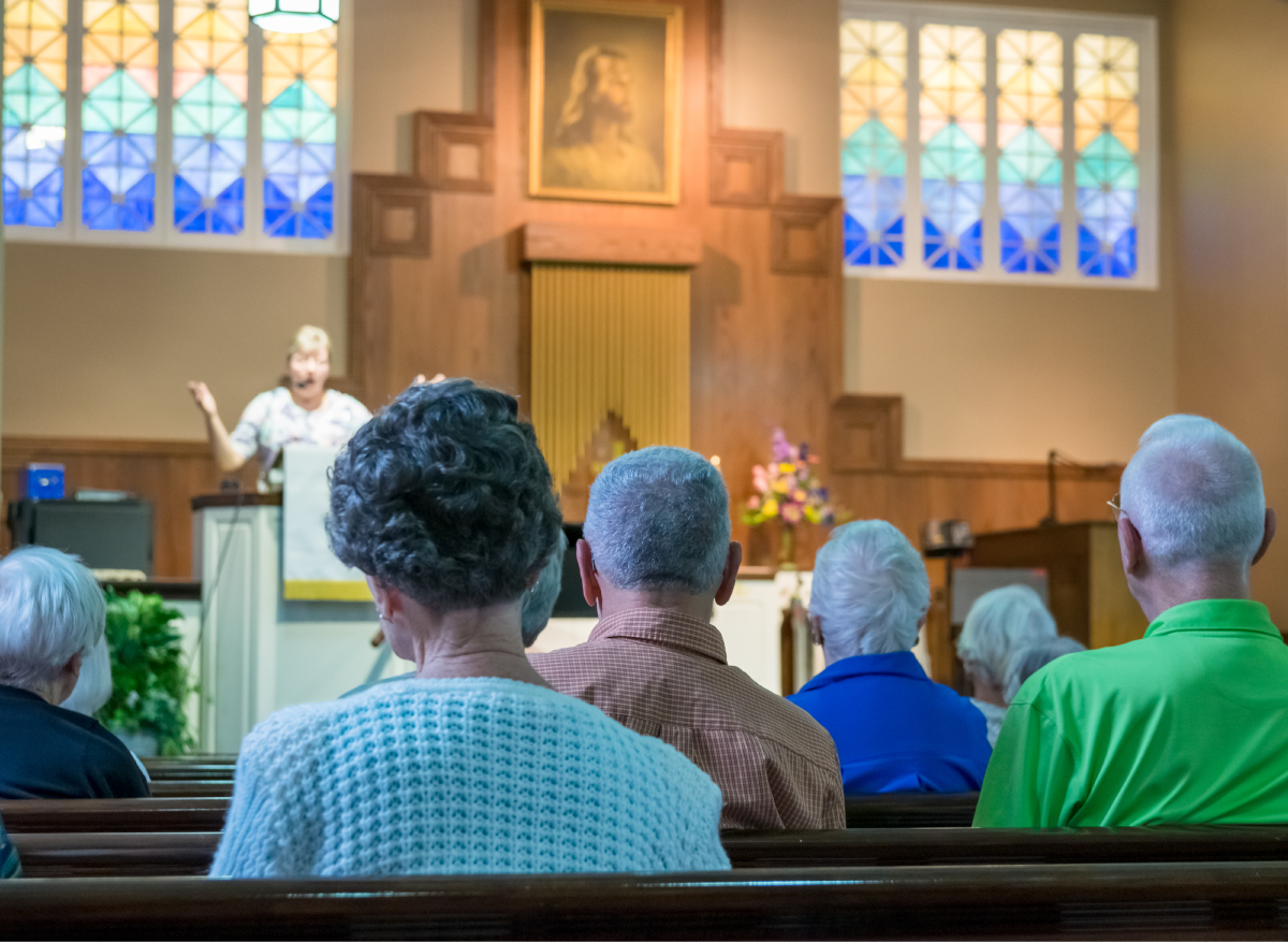 Seniors watching a speaker at mass