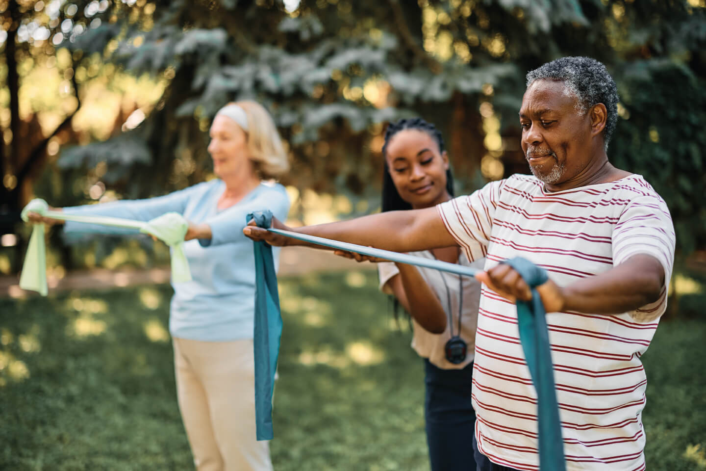 Senior man exercising with elastic band