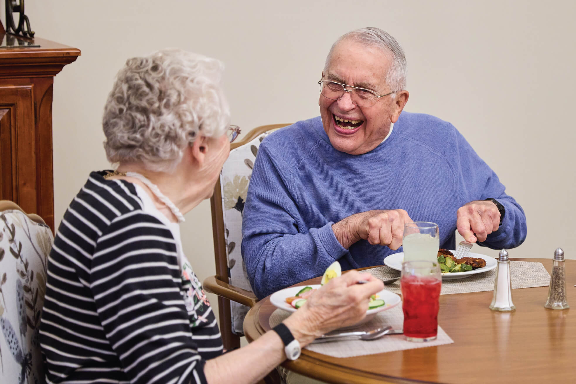 eating-dinner Man and woman sitting and eating dinner together
