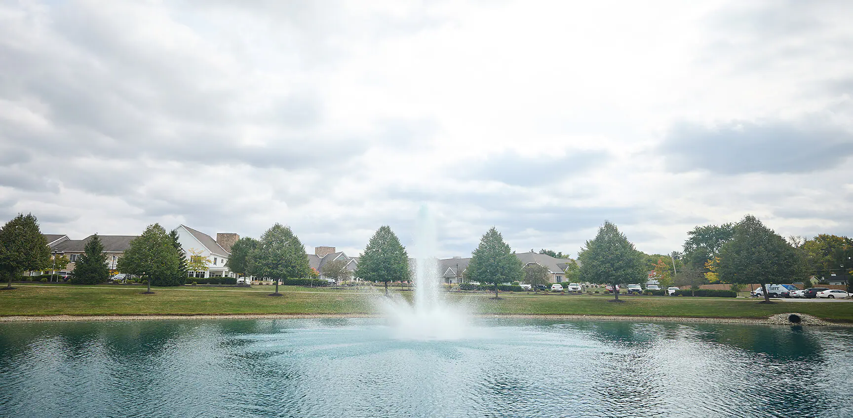Community pond with fountain on the grounds