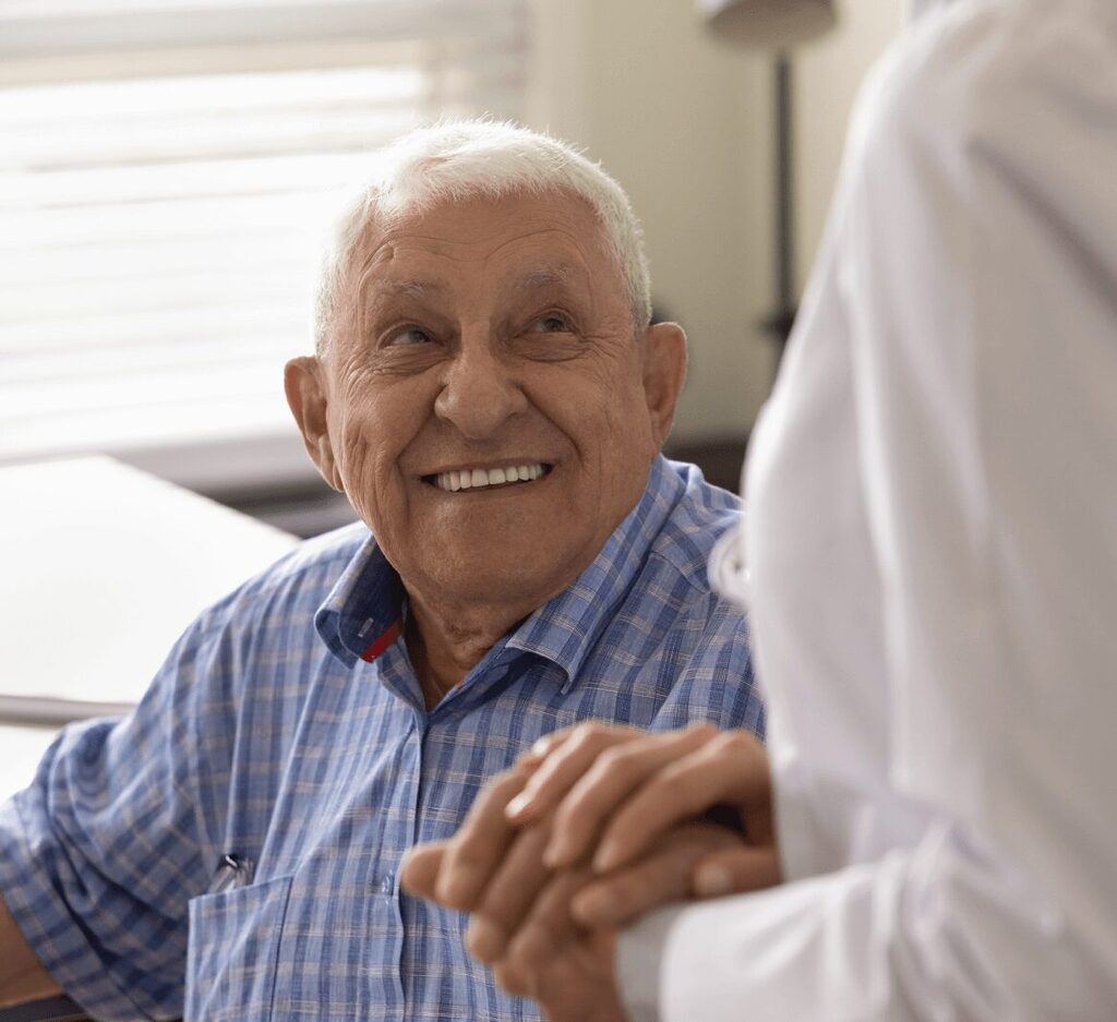 Holding senior mans hand
