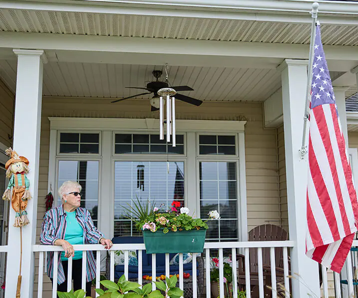 Senior woman on her front porch