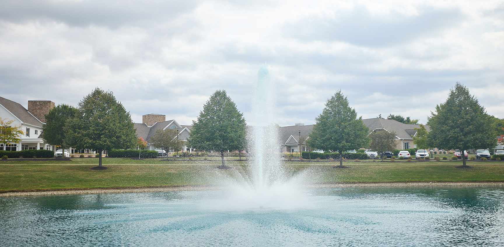 decorative water fountain in a community pond