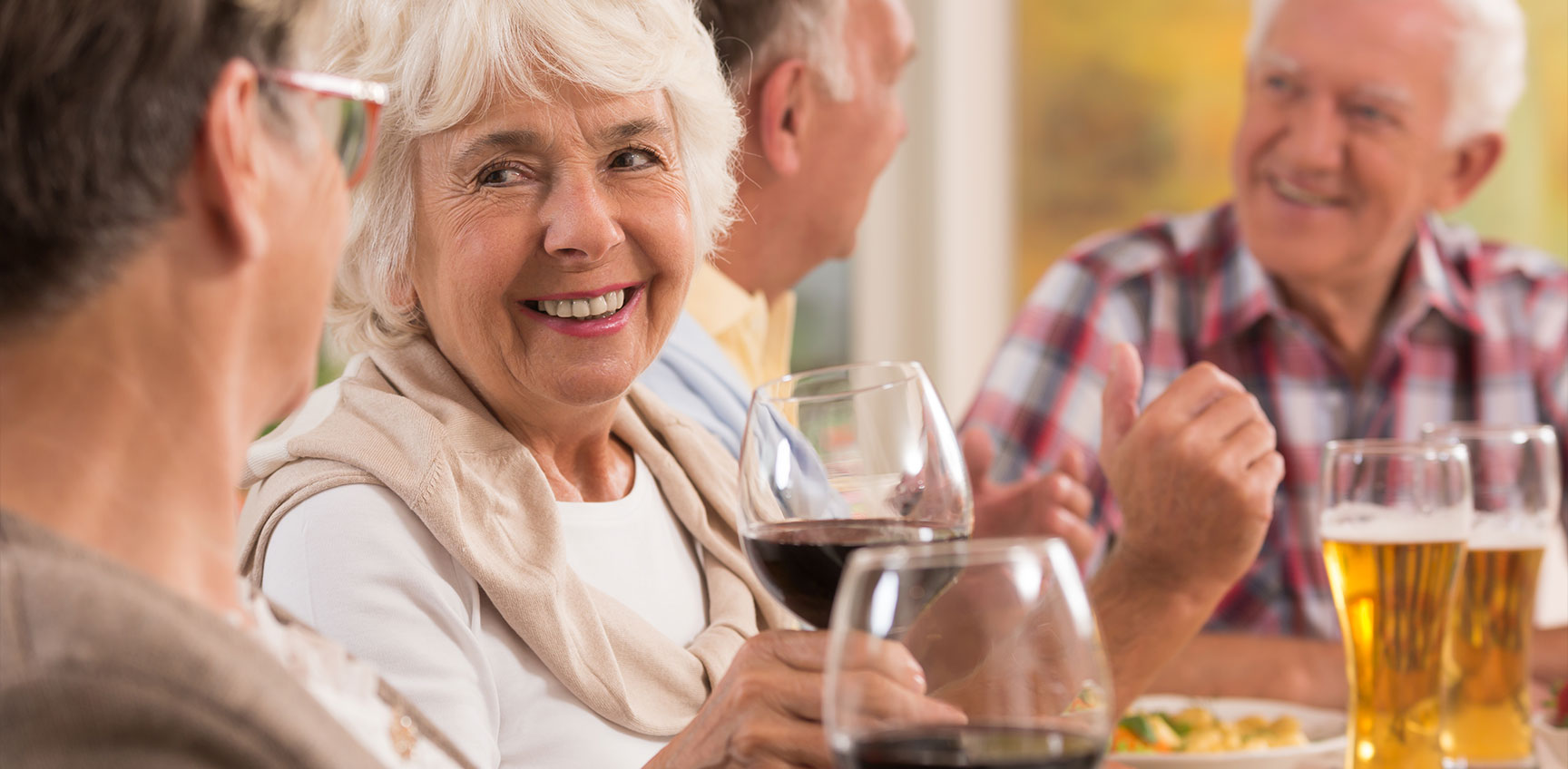 Seniors enjoying beverages around a table