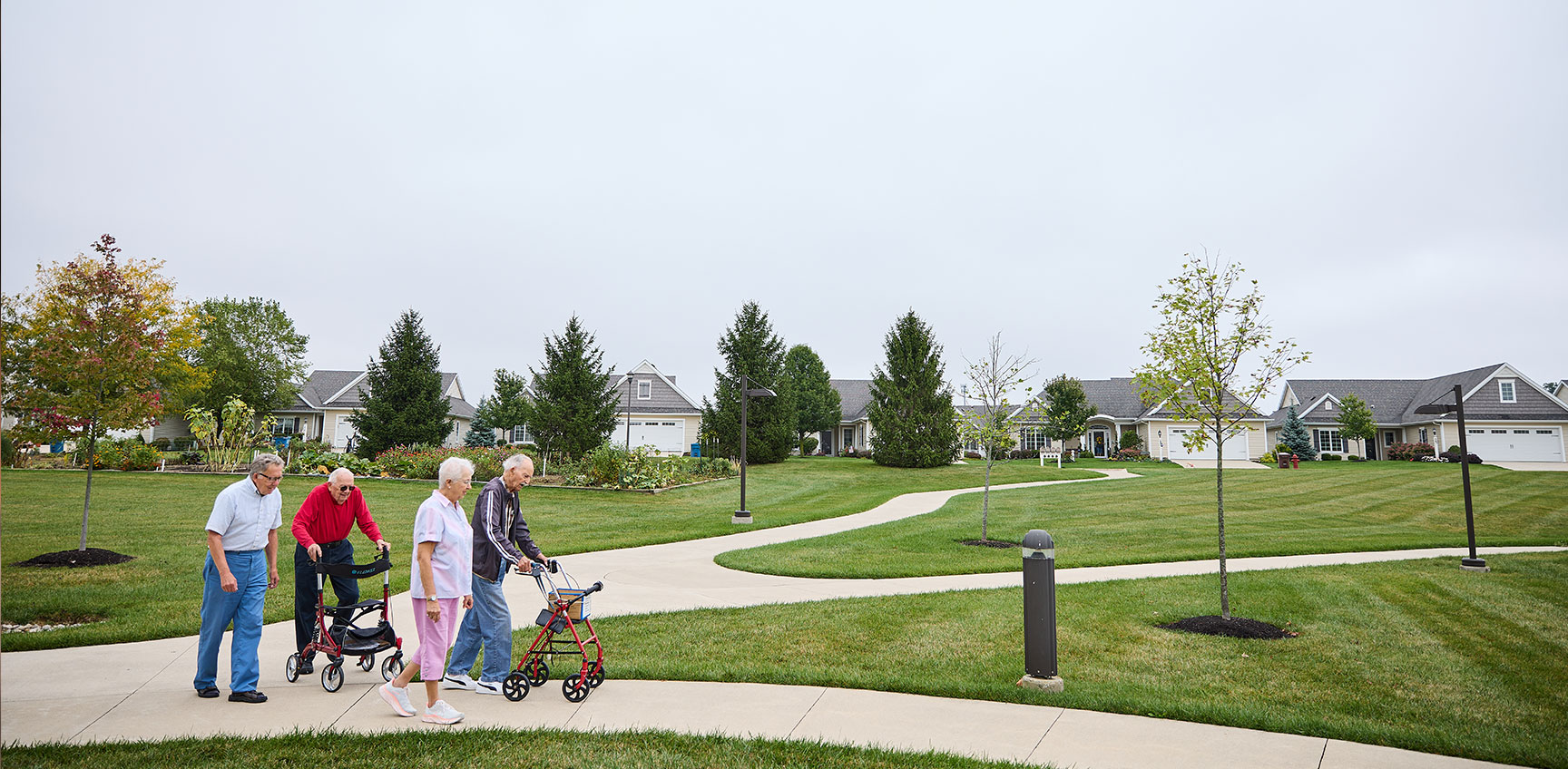 Group of seniors walking on a neighborhood path