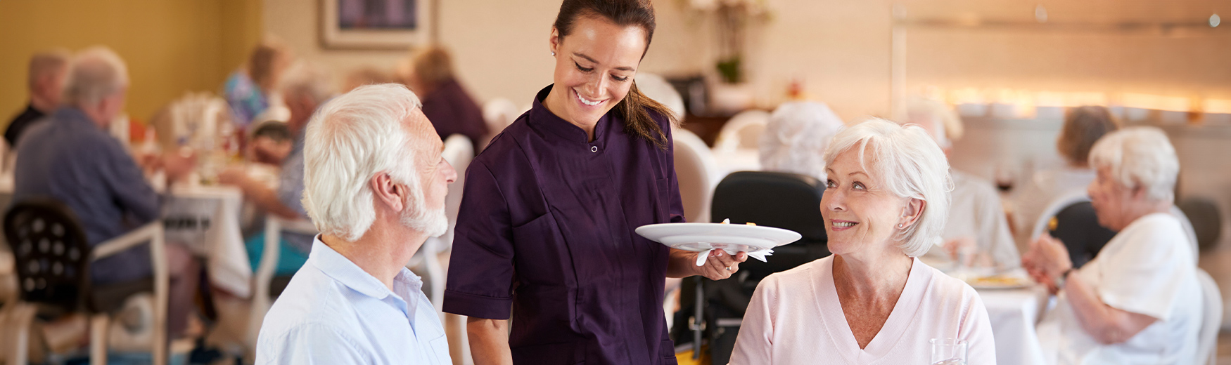 Server with plate in dining room