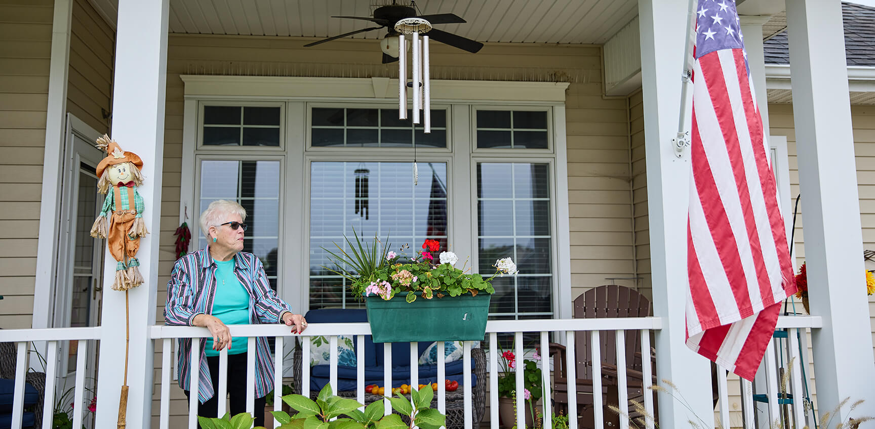 Woman standing on her front porch