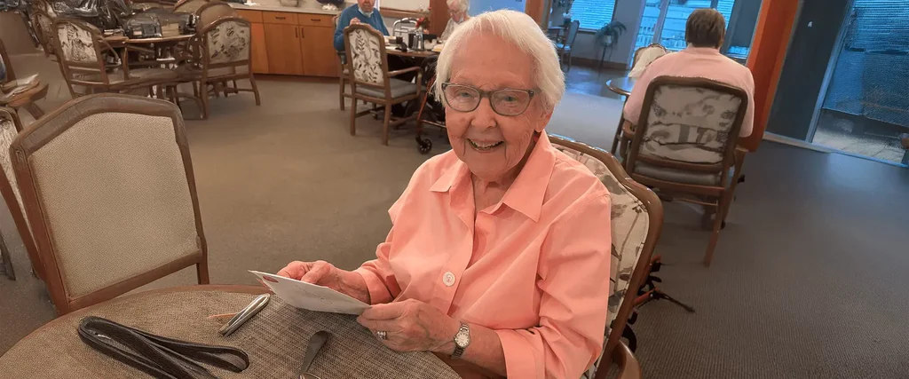 senior woman addressing christmas cards