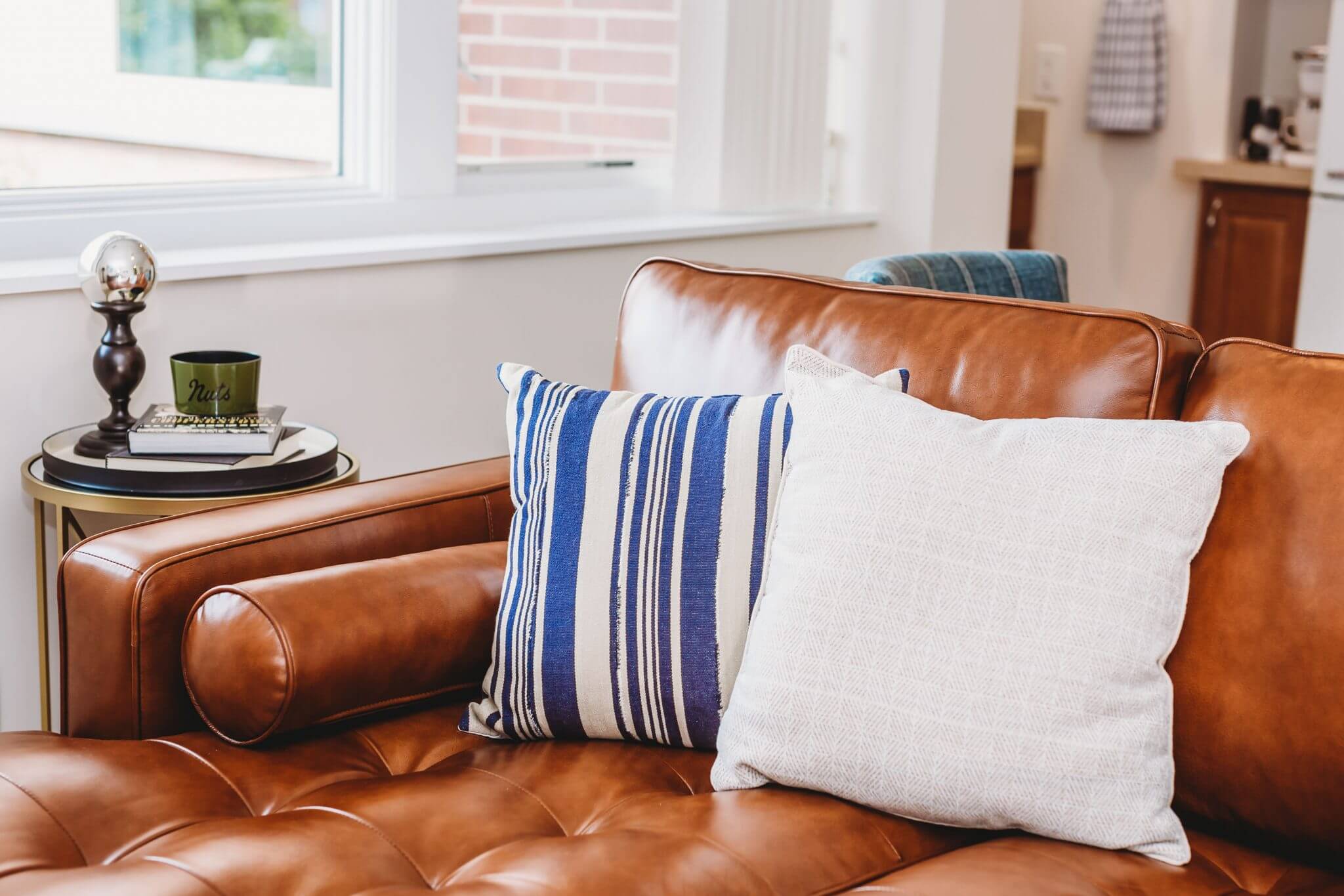 Luxurious leather couch with pillows for comfort