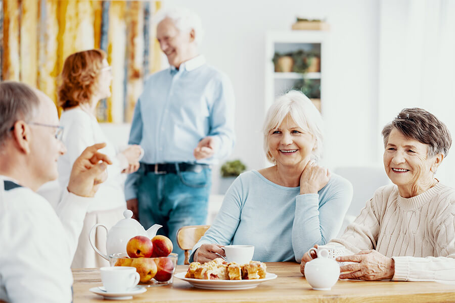 Senior friends sitting at breakfast