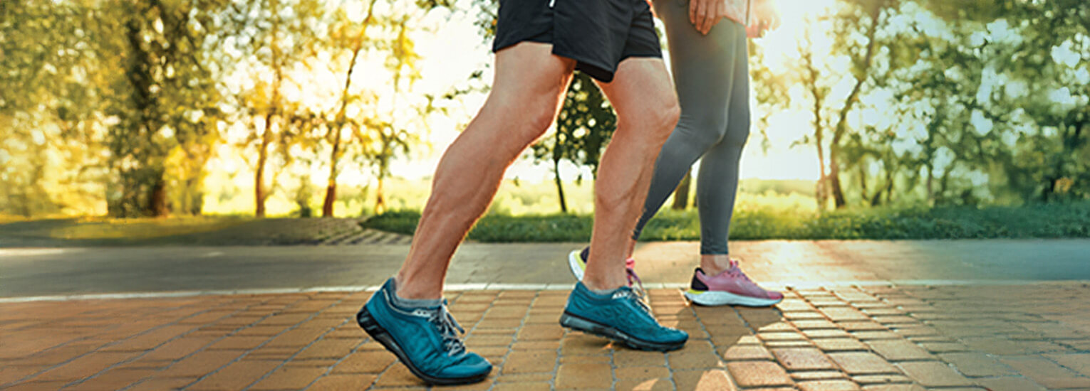Close up of seniors jogging outdoors