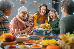 Happy family enjoying thanksgiving dinner