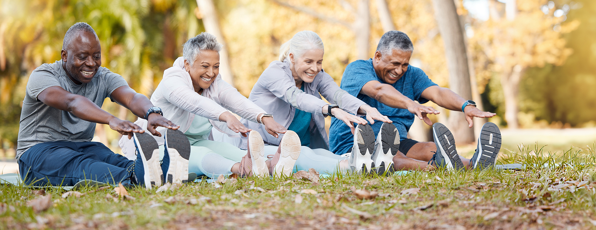 seniors touching their toes for stretching outdoors