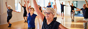Seniors stretching in a for older adults