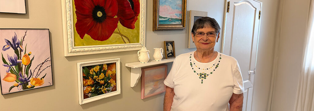 Marilyn Kaltenmark's art hung up in hallway gallery